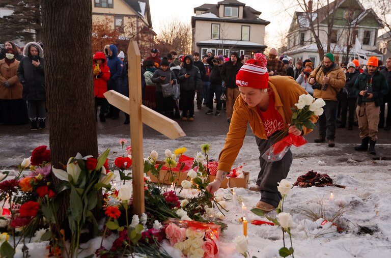 People gather for a vigil after an Immigration and Customs Enforcement officer shot and killed a motorist earlier in the day, Wednesday, Jan. 7, 2026, in Minneapolis.