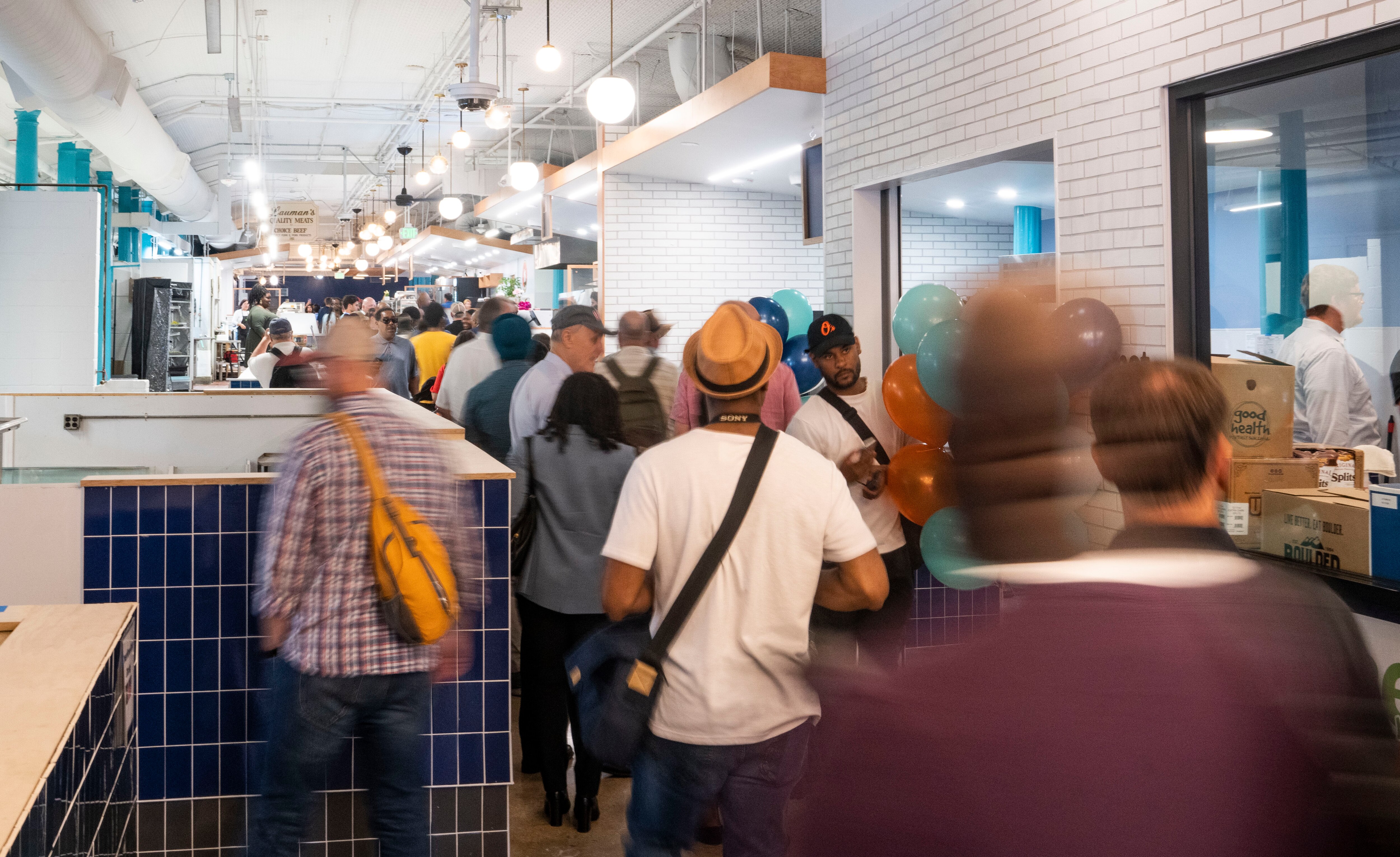Guests walk through Hollins Market, in Baltimore, Tuesday September 17, 2024.