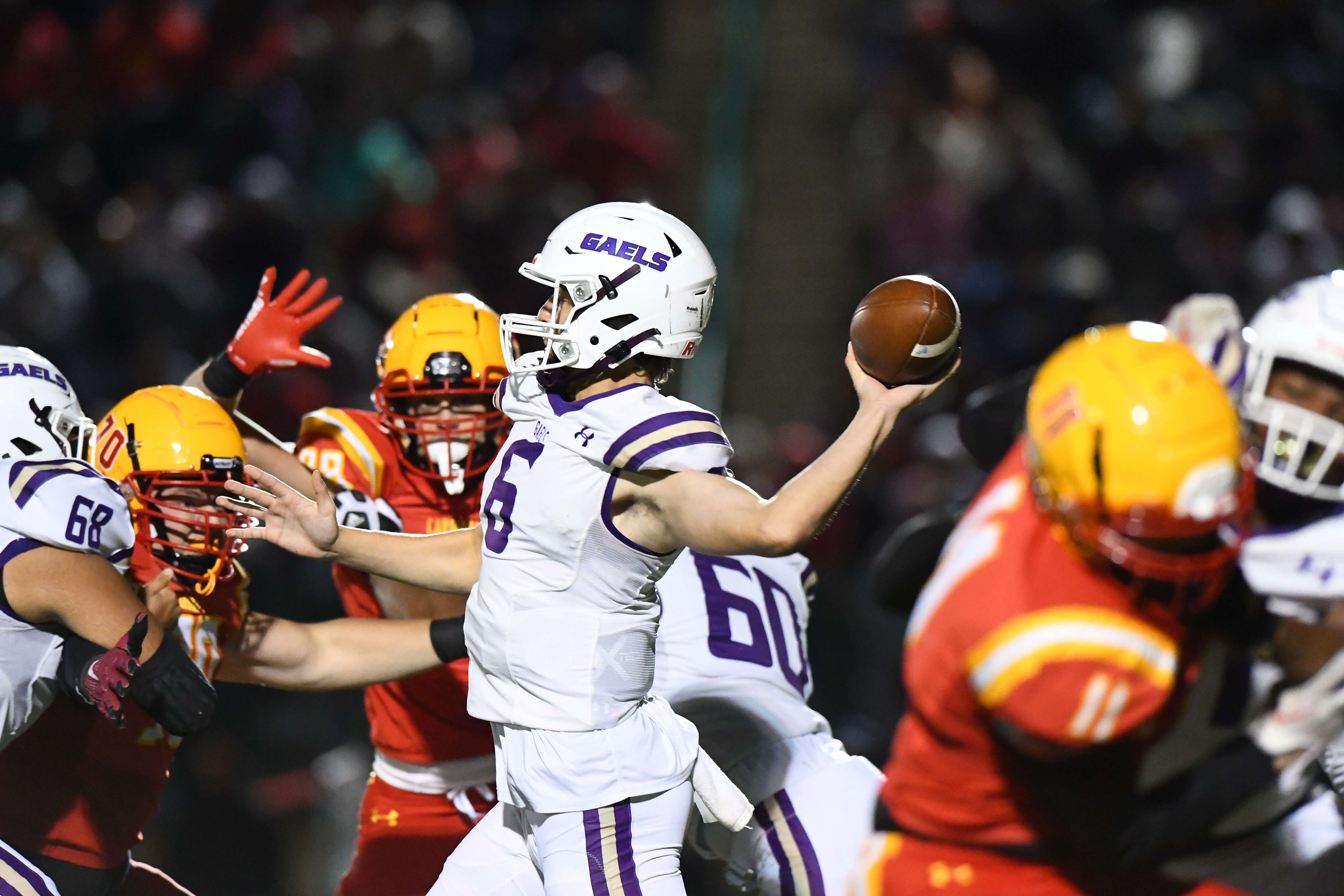 Mount St. Joseph lefty quarterback Winston Watkins (6) opened the scoring with a 28-yard TD pass to Trey Goodridge in the first quarter of St. Joe's 33-22 victory over Calvert Hall, Friday night.