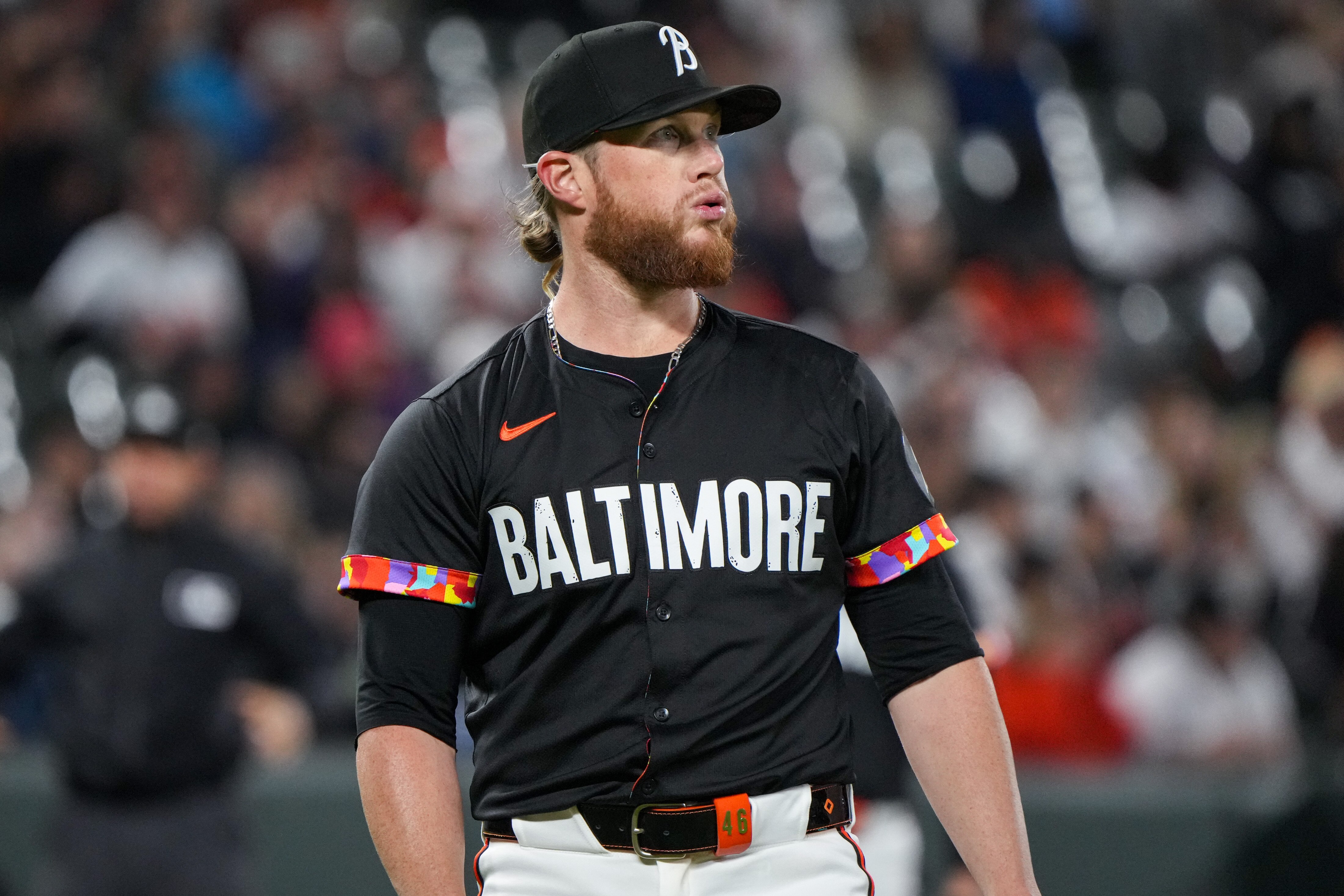 Baltimore Orioles pitcher Craig Kimbrel reacts as his teammates come to him for a mound meeting during game one of a series against the Oakland Athletics at Camden Yards on April 26, 2024.