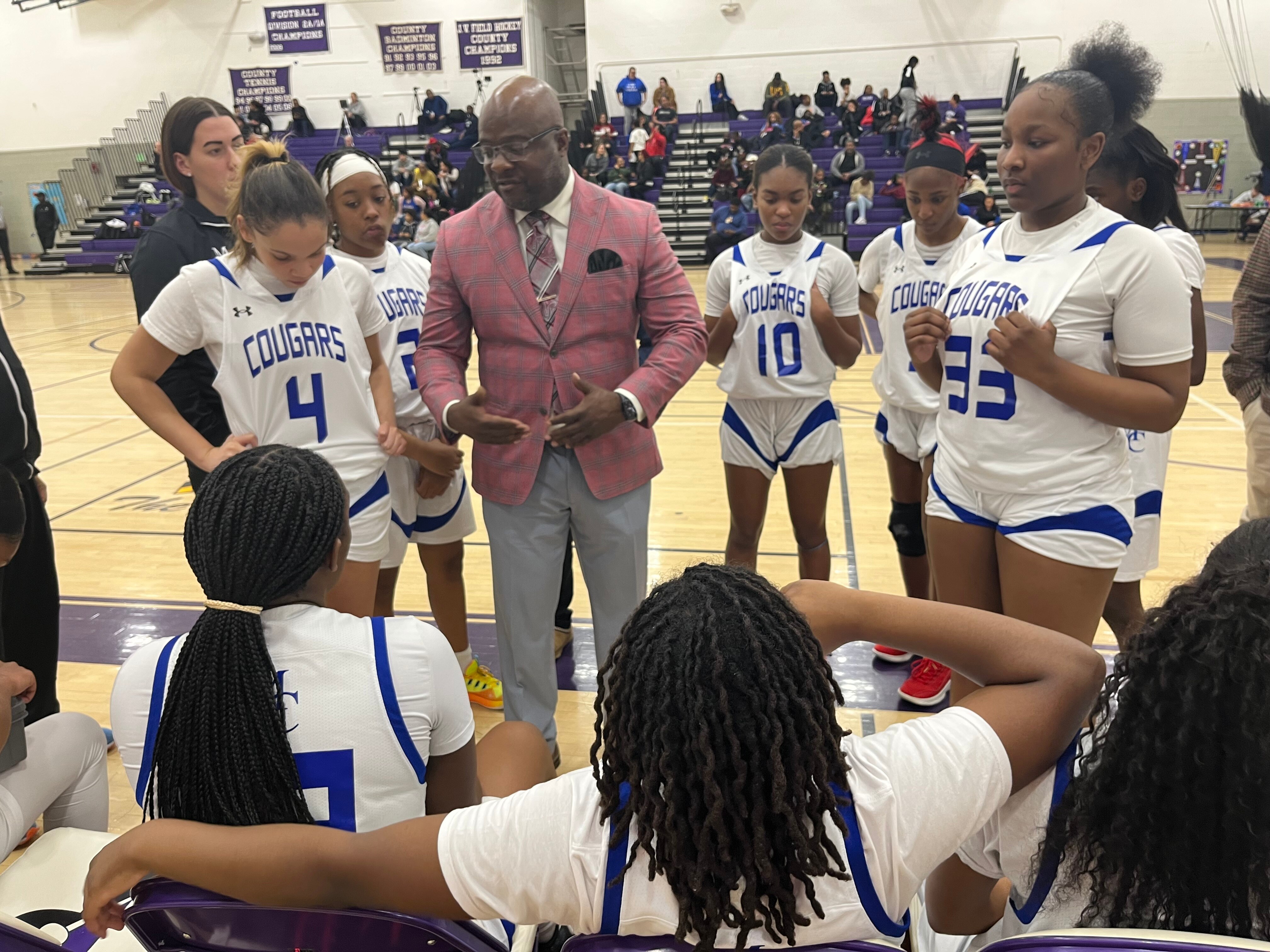 After stepping down from Mount Carmel last month, Rob Long (center is the new girls basketball coach at Rosedale Christian Academy.