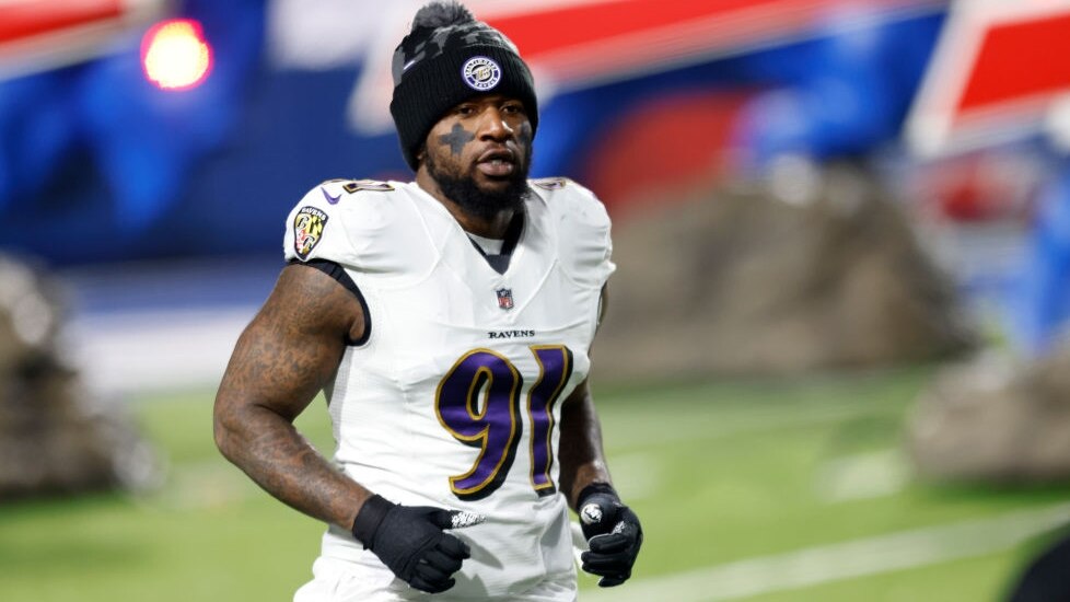 ORCHARD PARK, NEW YORK - JANUARY 16: Yannick Ngakoue #91 of the Baltimore Ravens runs on the field prior to an AFC Divisional Playoff game against the Buffalo Bills at Bills Stadium on January 16, 2021 in Orchard Park, New York. (Photo by Bryan Bennett/Getty Images)