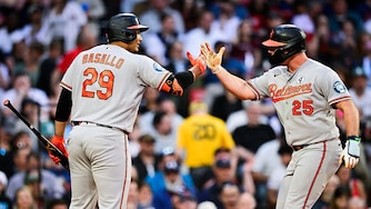 Orioles first baseman Pete Alonso is greeted at home by designated hitter Samuel Basallo after hitting a two-run home run in the third inning.