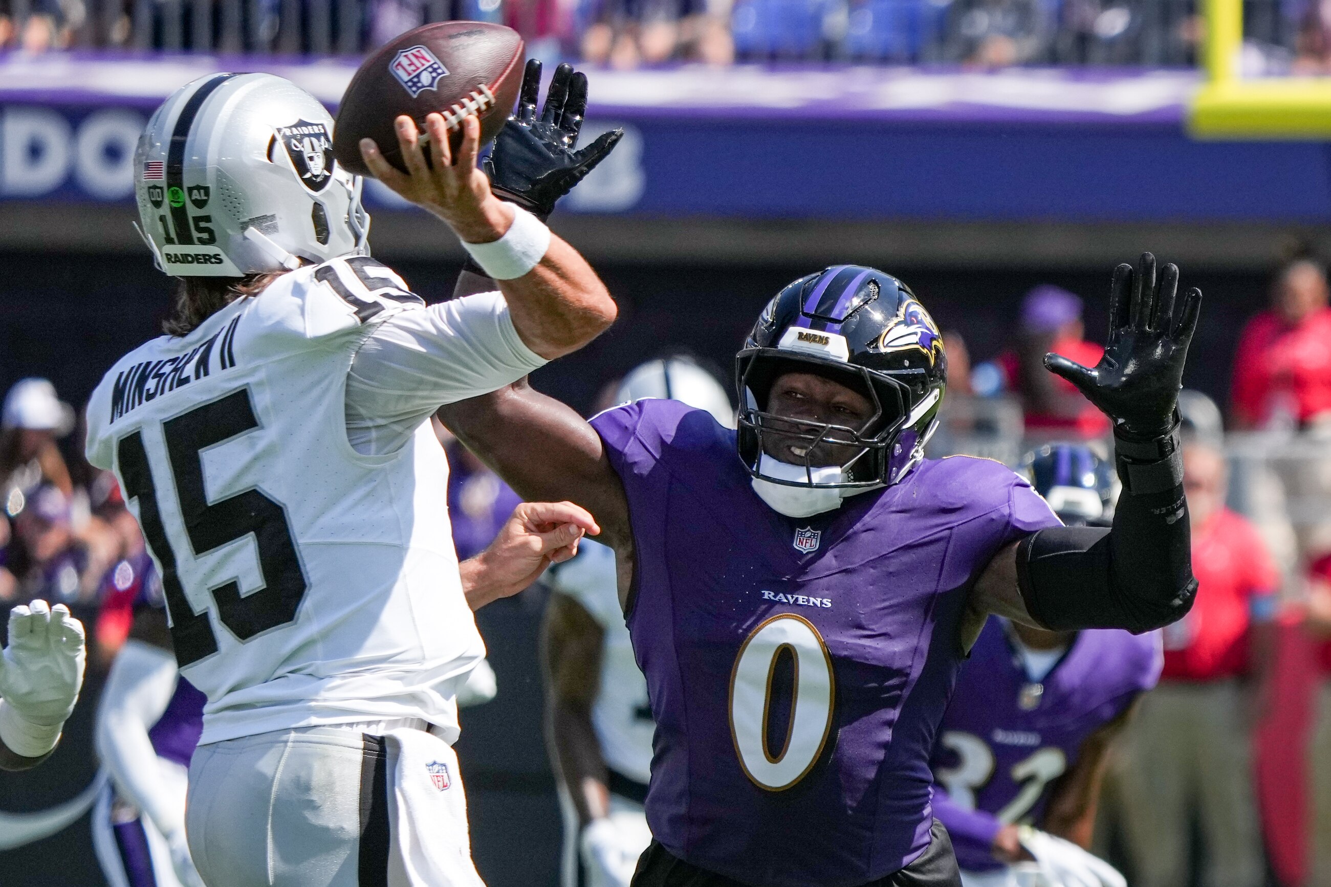 Baltimore Ravens linebacker Roquan Smith (0) guards Las Vegas Raiders quarterback Gardner Minshew (15) during a game at M&T Bank Stadium in Baltimore on Sunday, September 15, 2024.
