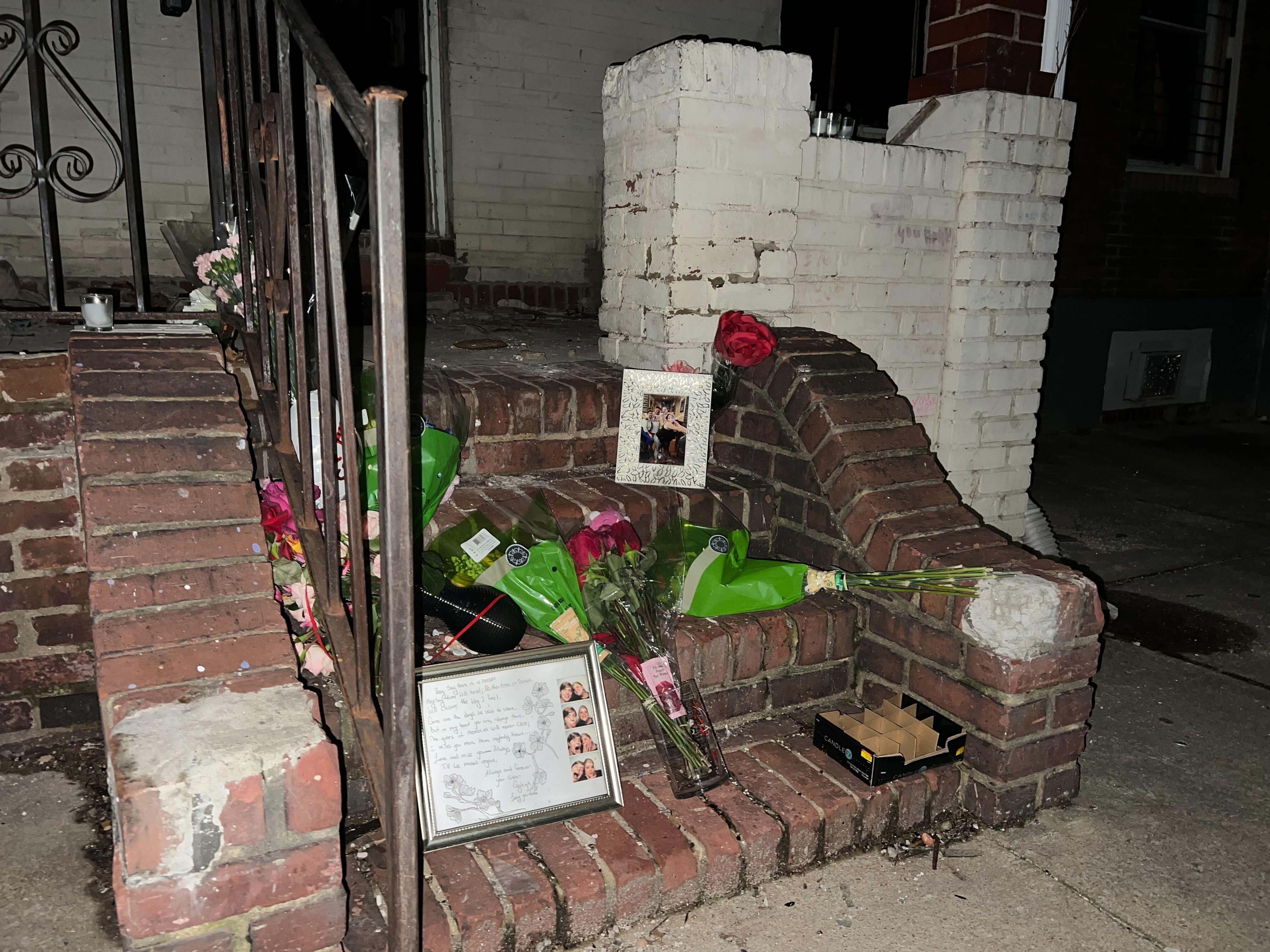 A memorial is set up for Brittany Wolf on the steps of a vacant home in East Baltimore where she died of smoke inhalation.