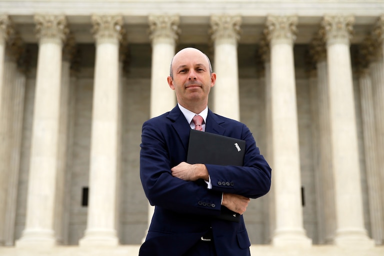 Tom Goldstein, who writes SCOTUSblog.com, poses for a photograph in front of the Supreme Court, Oct. 31, 2013, in Washington.