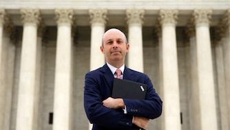 Tom Goldstein, who writes SCOTUSblog.com, poses for a photograph in front of the Supreme Court, Oct. 31, 2013, in Washington.