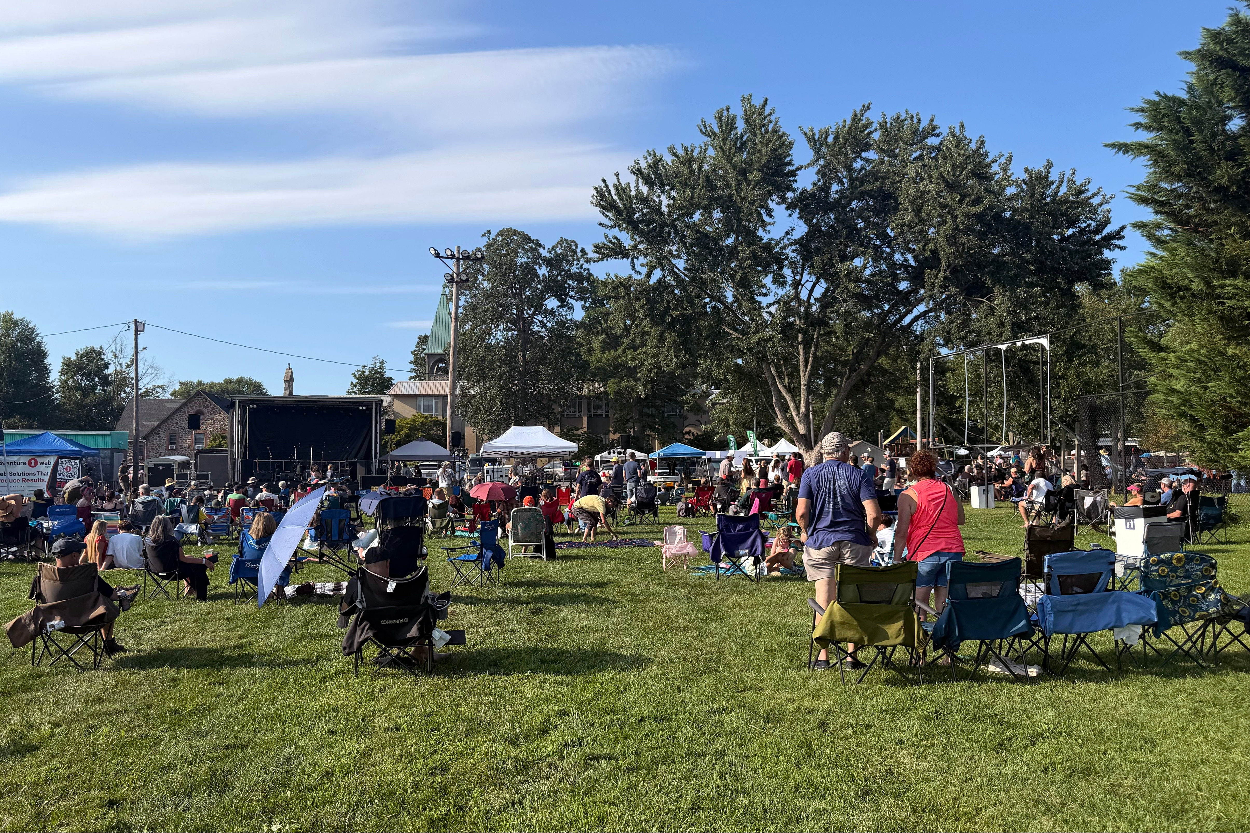 Attendees for Music City Maryland Association's "Arts Festival" set up their lawn chairs in front of two temporary stages on the ball fields at CAA Park in Catonsville on Aug. 29.