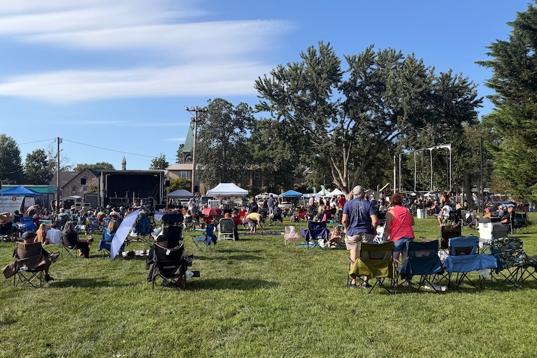 Attendees for Music City Maryland Association's "Arts Festival" set up their lawn chairs in front of two temporary stages on the ball fields at CAA Park in Catonsville on Aug. 29.