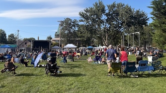 Attendees for Music City Maryland Association's "Arts Festival" set up their lawn chairs in front of two temporary stages on the ball fields at CAA Park in Catonsville on Aug. 29.