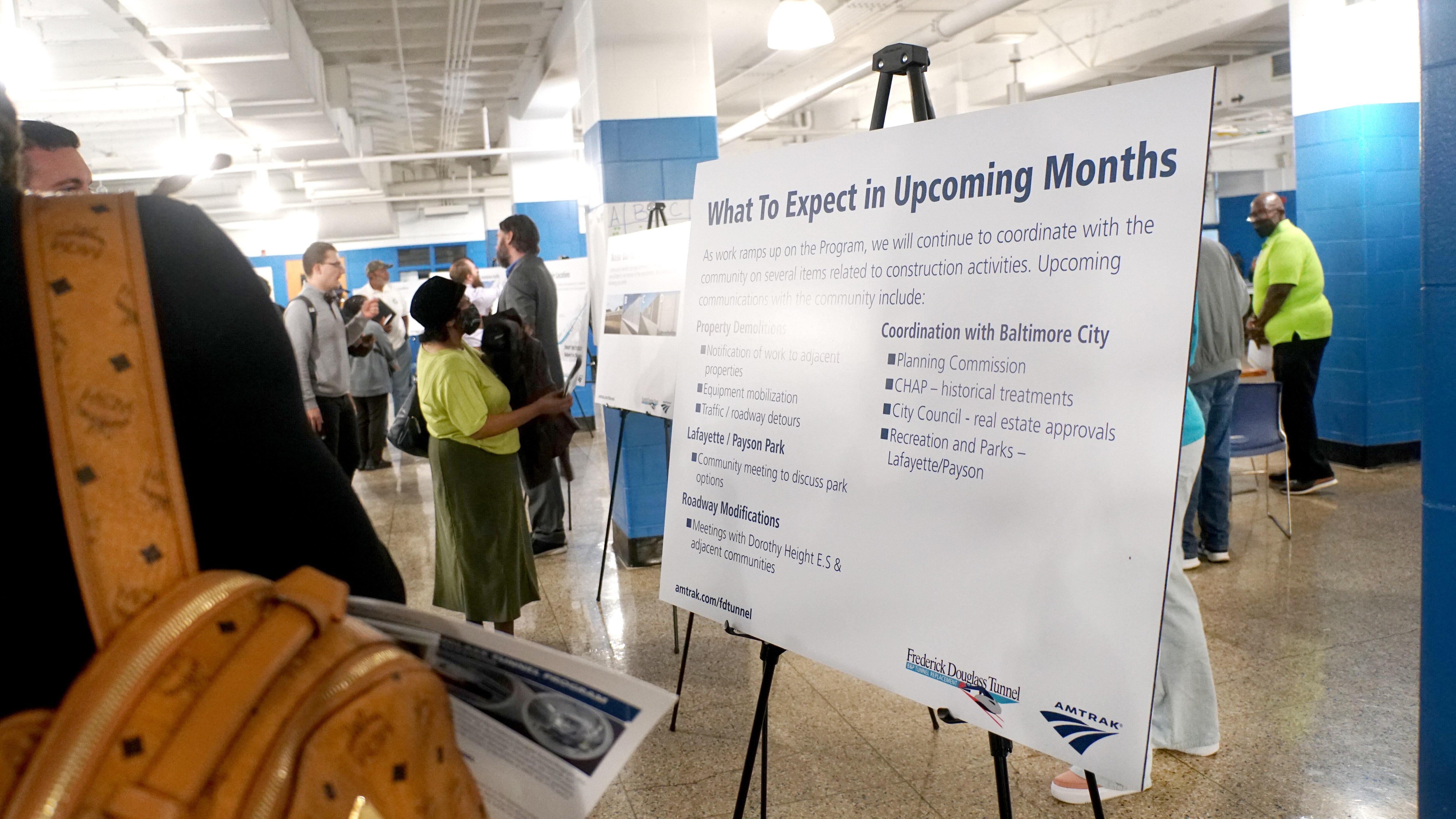 Passenger rail company Amtrak hosted an open house-style community meeting at Carver Vocational-Technical High School on Sept. 26, 2023 to offer details about construction of the Frederick Douglass Tunnel Program, which will bore two new two-mile tunnel tubes underneath parts of West Baltimore.