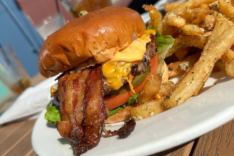 The Ronin burger from Kooper's Tavern comes with 100% Black Angus beef, applewood-smoked bacon, pickles, lettuce, tomato, onion, cheese and chipotle aioli.