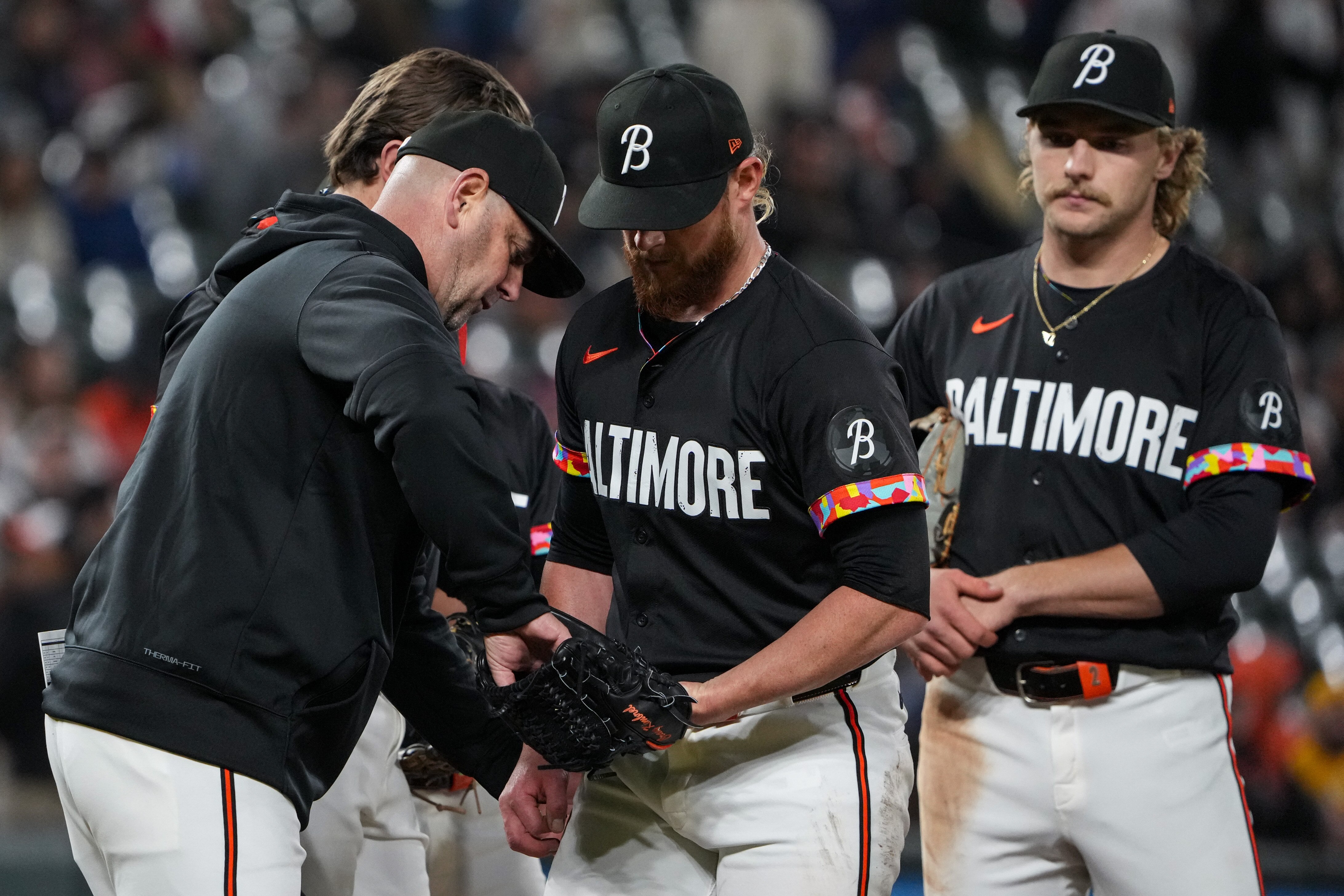 Orioles manager Brandon Hyde takes the ball from pitcher Craig Kimbrel in the ninth inning of a game in April. The team stuck with Kimbrel during a difficult stretch earlier in the season.