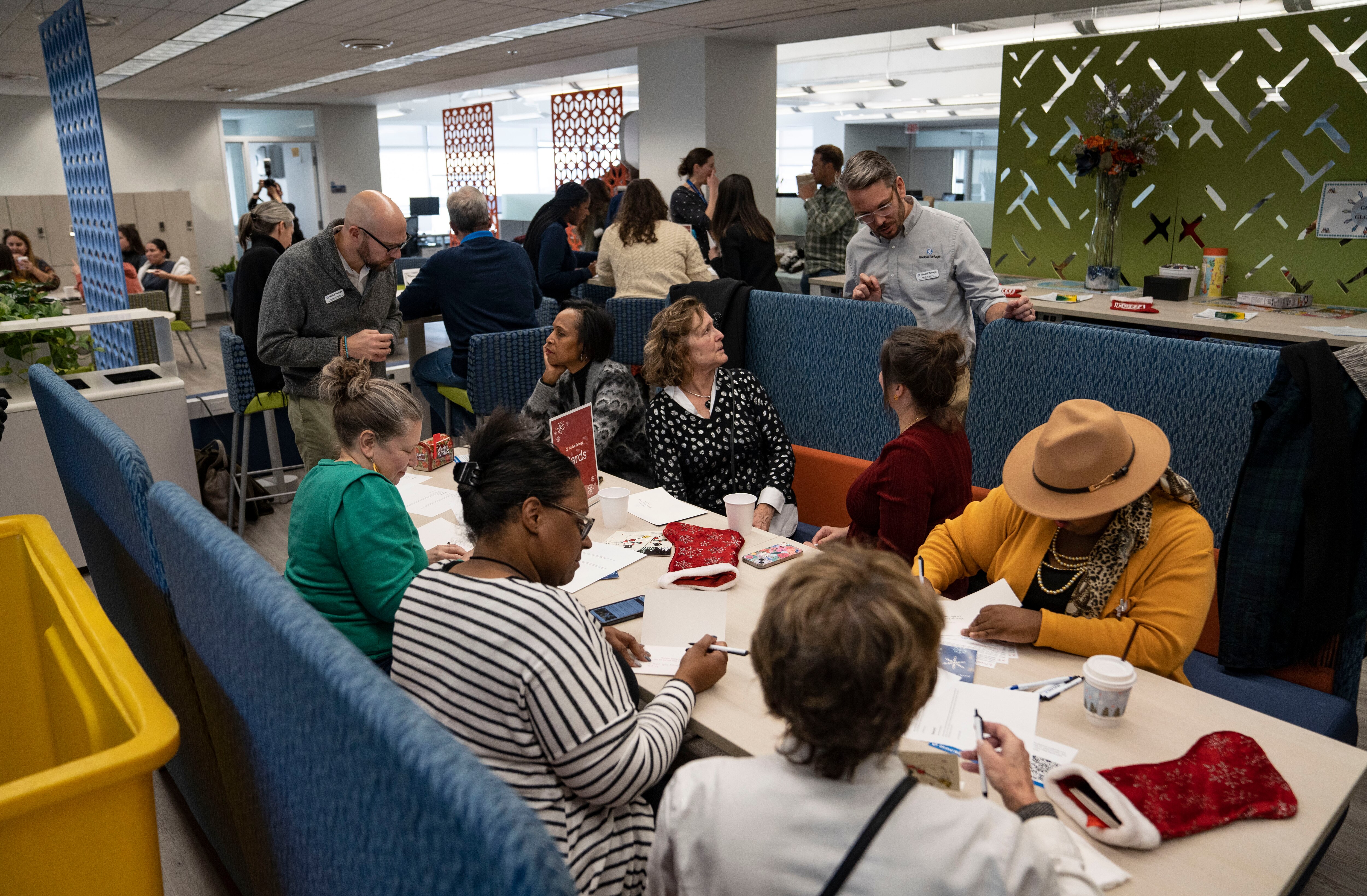 Guests write holiday cards to newly-arrived immigrant neighbors across the country during Global Refuge’s 10th annual Hope for the Holidays campaign in Baltimore, Md., on Friday, December 6, 2024.