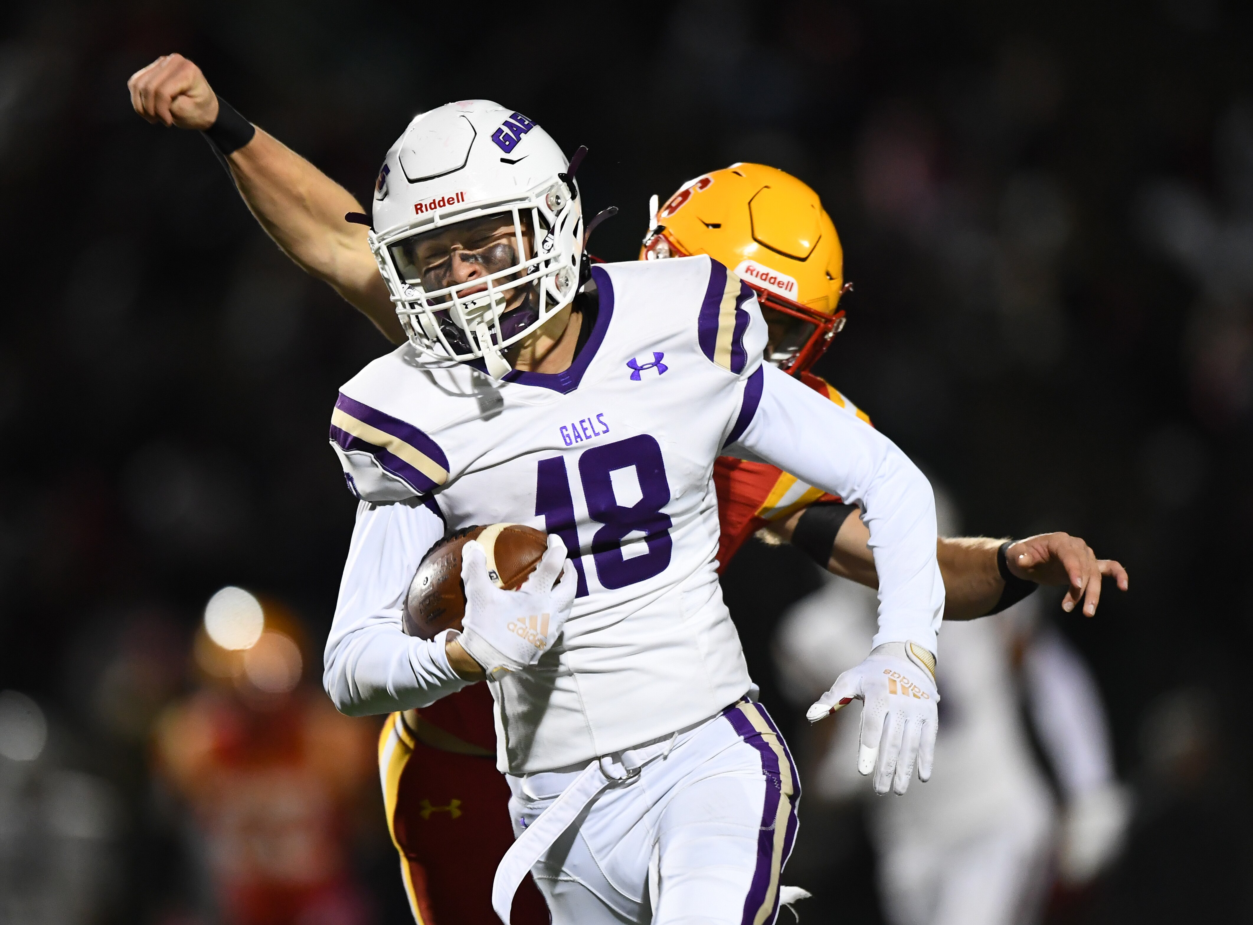 Mount St. Joseph sophomore receiver Peyton Youngbar gets some yards after the catch during Friday's 33-22 win by Mount St. Joseph over Calvert Hall.