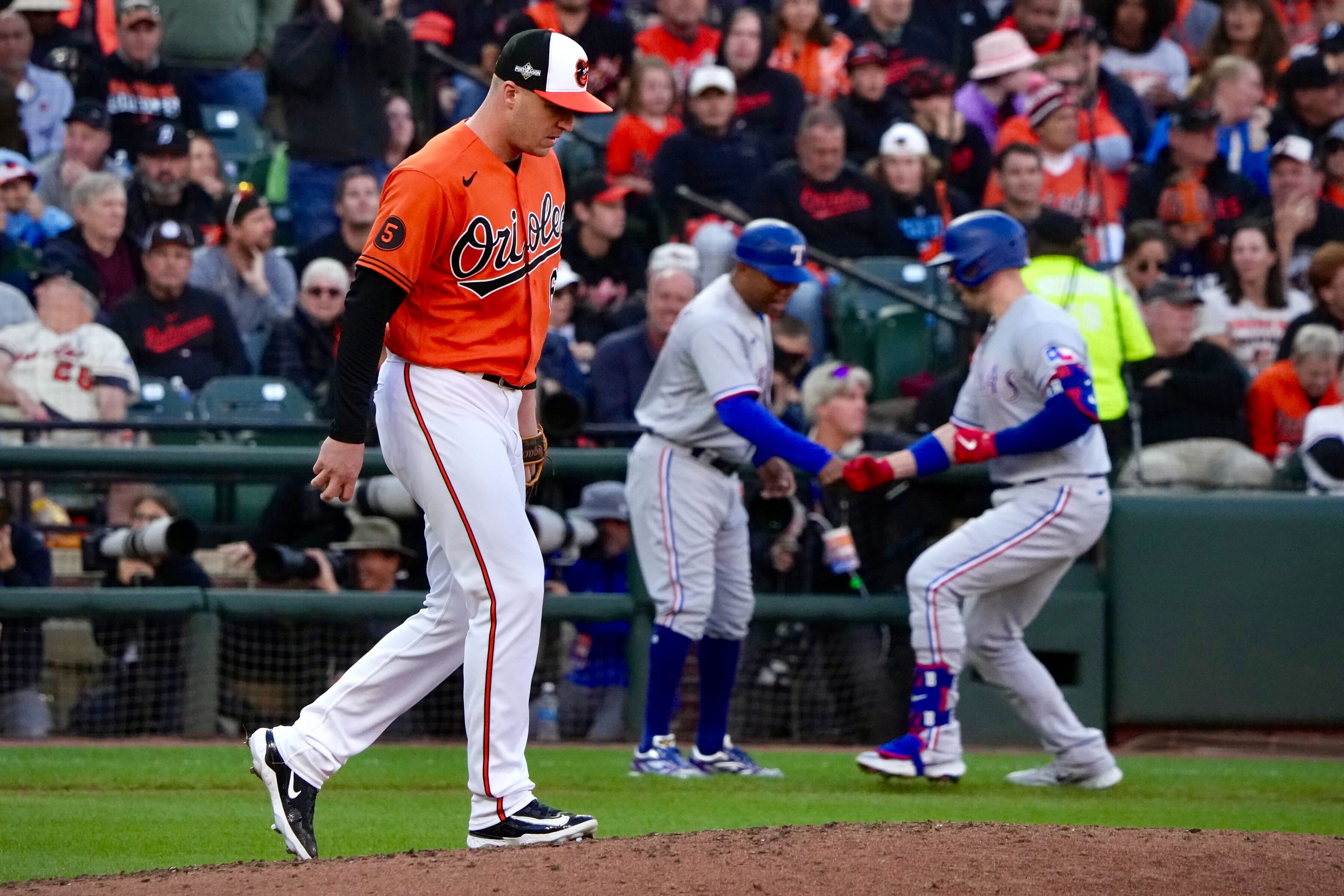 Orioles pitcher Jacob Webb walks back to the mound after allowing Mitch Garver's grand slam in the third inning of the Rangers' 11-8 win in Game 2 of the American League Division Series.