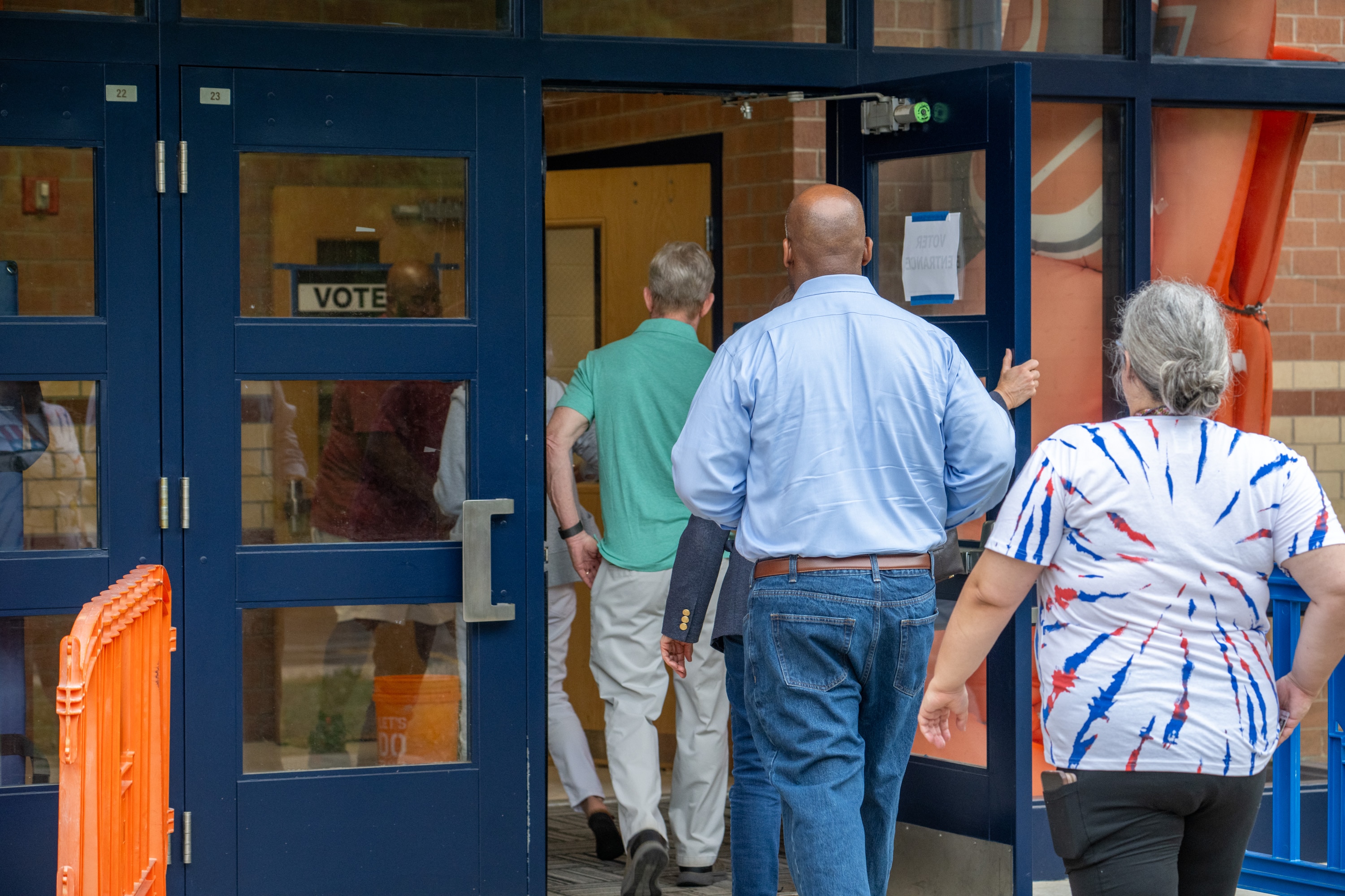 People arrive to vote at Reservoir High School in Fulton during Primary Election Day on Tuesday.