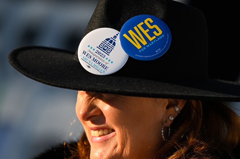 Dana DiCarlo of Baltimore sits awaiting the start of the swearing in ceremony of Wes Moore, Wednesday, Jan. 18, 2023, in Annapolis.