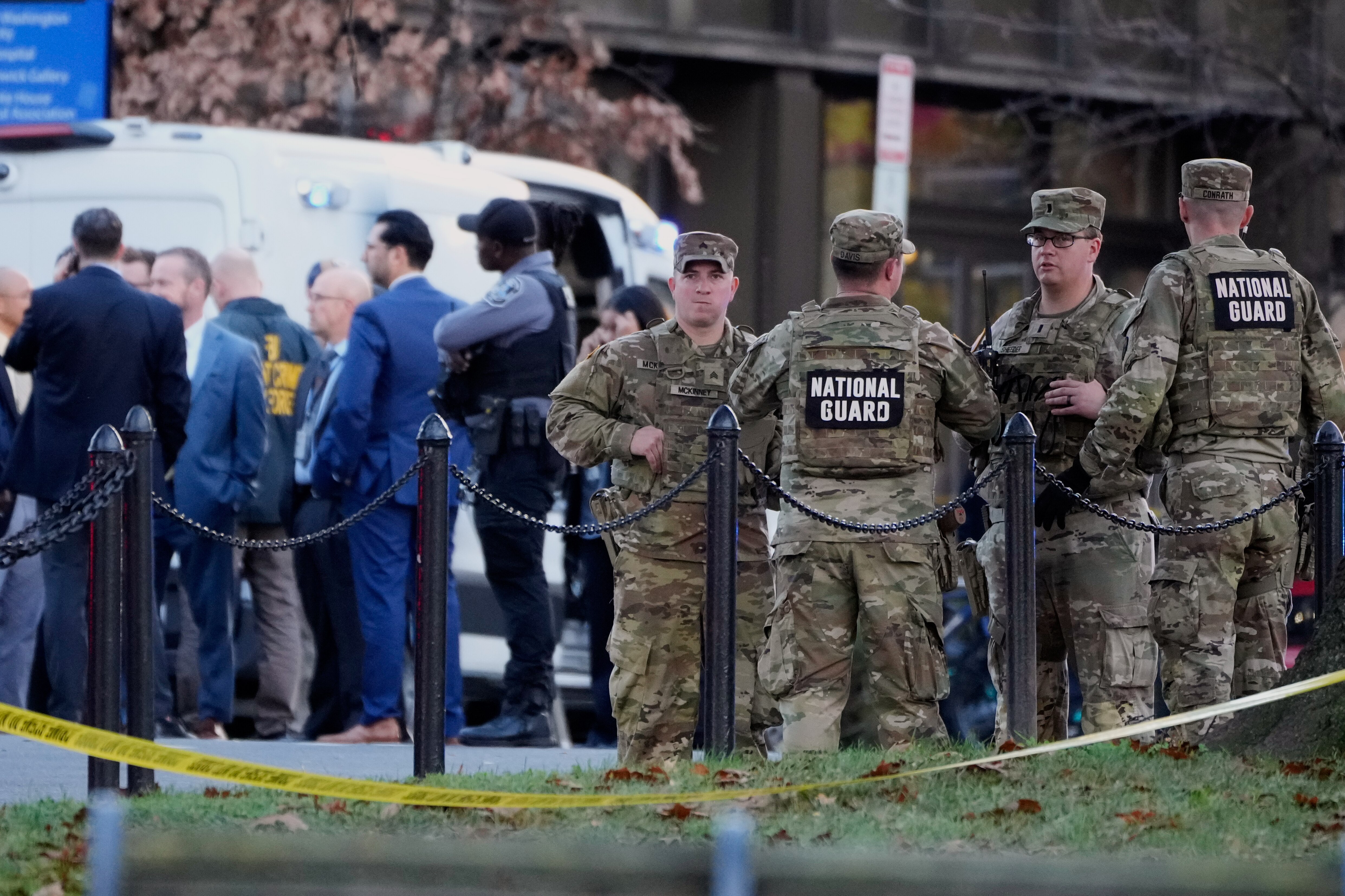 Emergency personnel gather in a cordoned off area where National Guard soldiers were shot near the White House Wednesday, Nov. 26, 2025, in Washington. (AP Photo/Mark Schiefelbein)