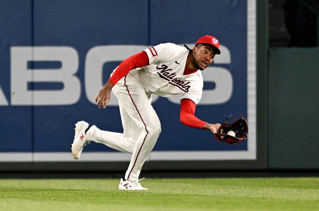 Washington Nationals right fielder James Wood catches a fly ball in the eighth inning.
