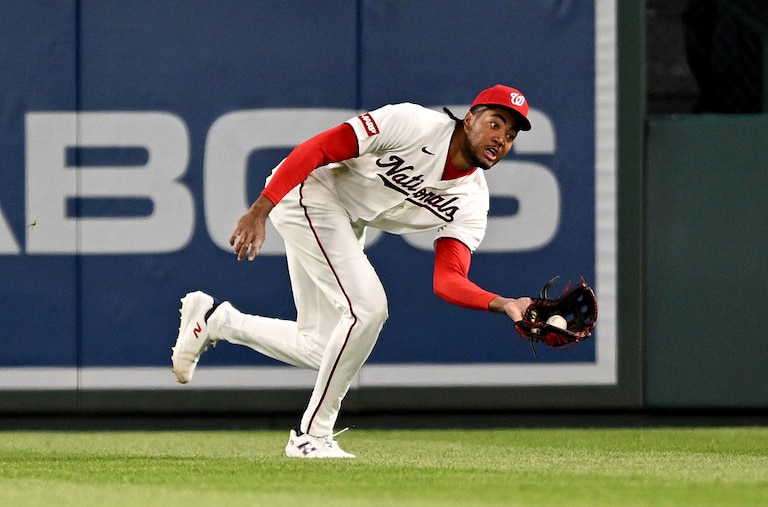 Washington Nationals right fielder James Wood catches a fly ball in the eighth inning.