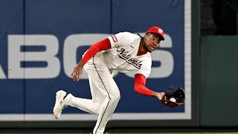Washington Nationals right fielder James Wood catches a fly ball in the eighth inning.