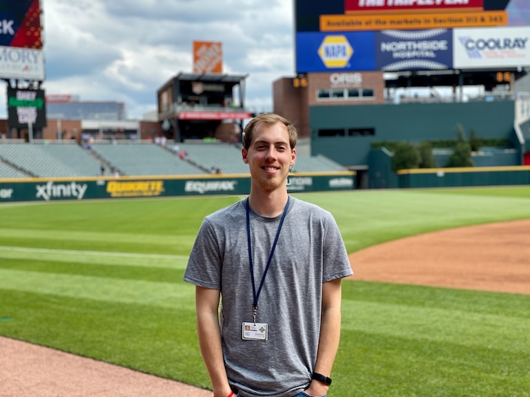 Andy Kostka standing at Truist Park in Atlanta.