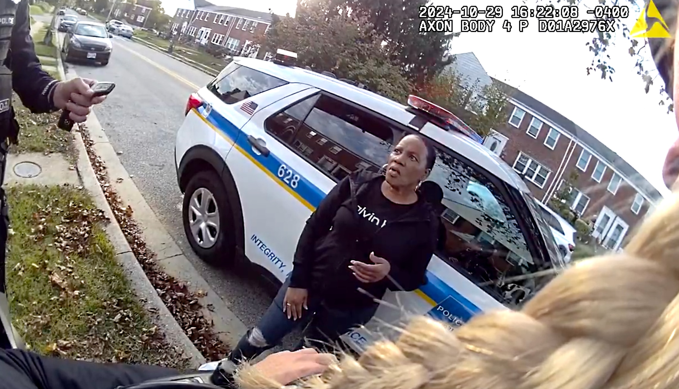 A still from body camera footage shows Baltimore County Police officers arresting Jackie Conway last year.