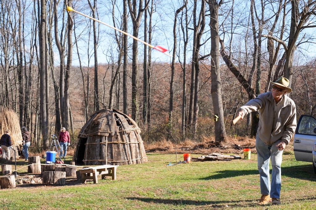 Cliff Essman launches a spear with an atlatl, a rod that helps generate additional force, during a demonstration at the Irvine Nature Center’s Native American Educational Site in Owings Mills, Md., on Thursday, November 13, 2025. The Center will host a free Indigenous Peoples Celebration on Sunday, November 23.