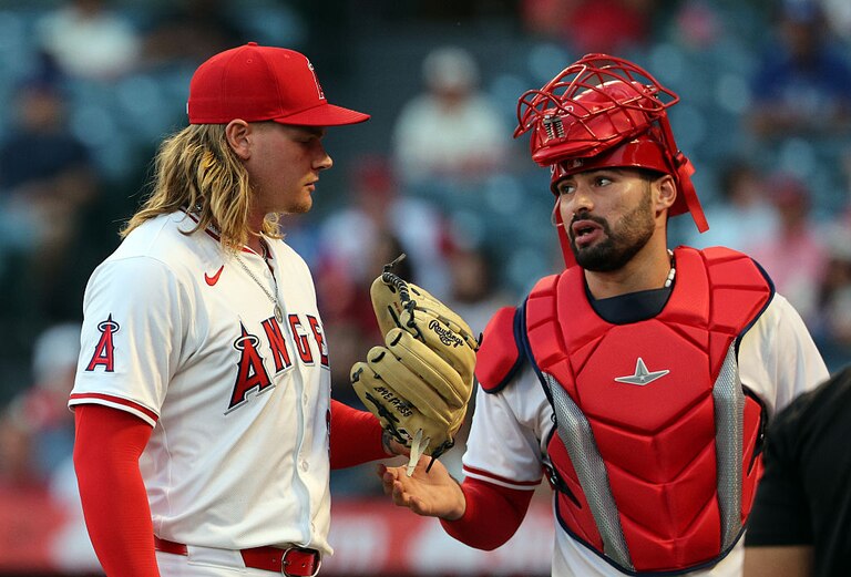 Catcher Sebastián Rivero talks with starting pitcher Caden Dana after the last out of the first inning against Minnesota Twins on Sept. 8.