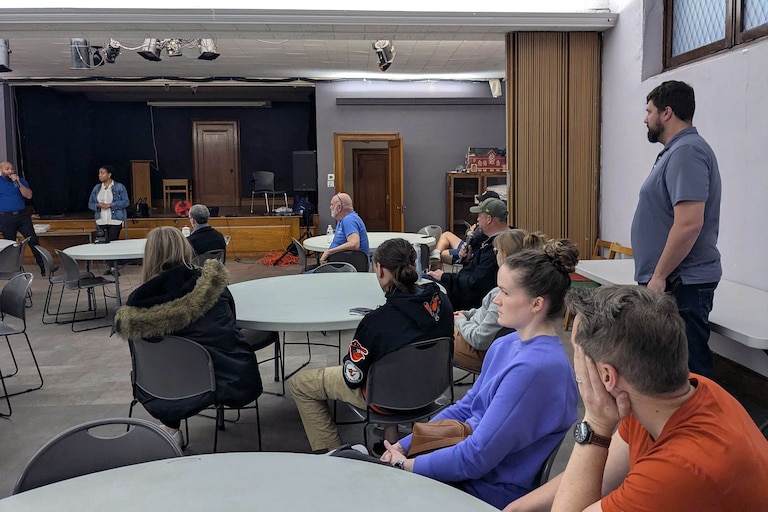 Monday, March 30, 2026 - Christiano Quijano, an energy assistance and community engagement manager for BGE, and Lineta Duren, a community engagement manager for BGE, speak at a meeting with the Riverside Neighborhood Association at Salem Lutheran Church in Baltimore. Jeff Newberry, president of Riverside Neighborhood Association, stands at right.