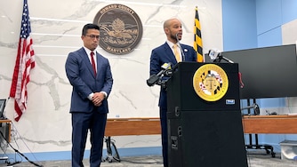 Howard County State’s Attorney Rich Gibson Jr., right, speaks after a man was sentenced to life in prison without the possibility of parole plus 70 years in the fatal shootings of two teens near The Mall in Columbia in 2025. Senior Assistant State's Attorney Dillon Yeung is at left.