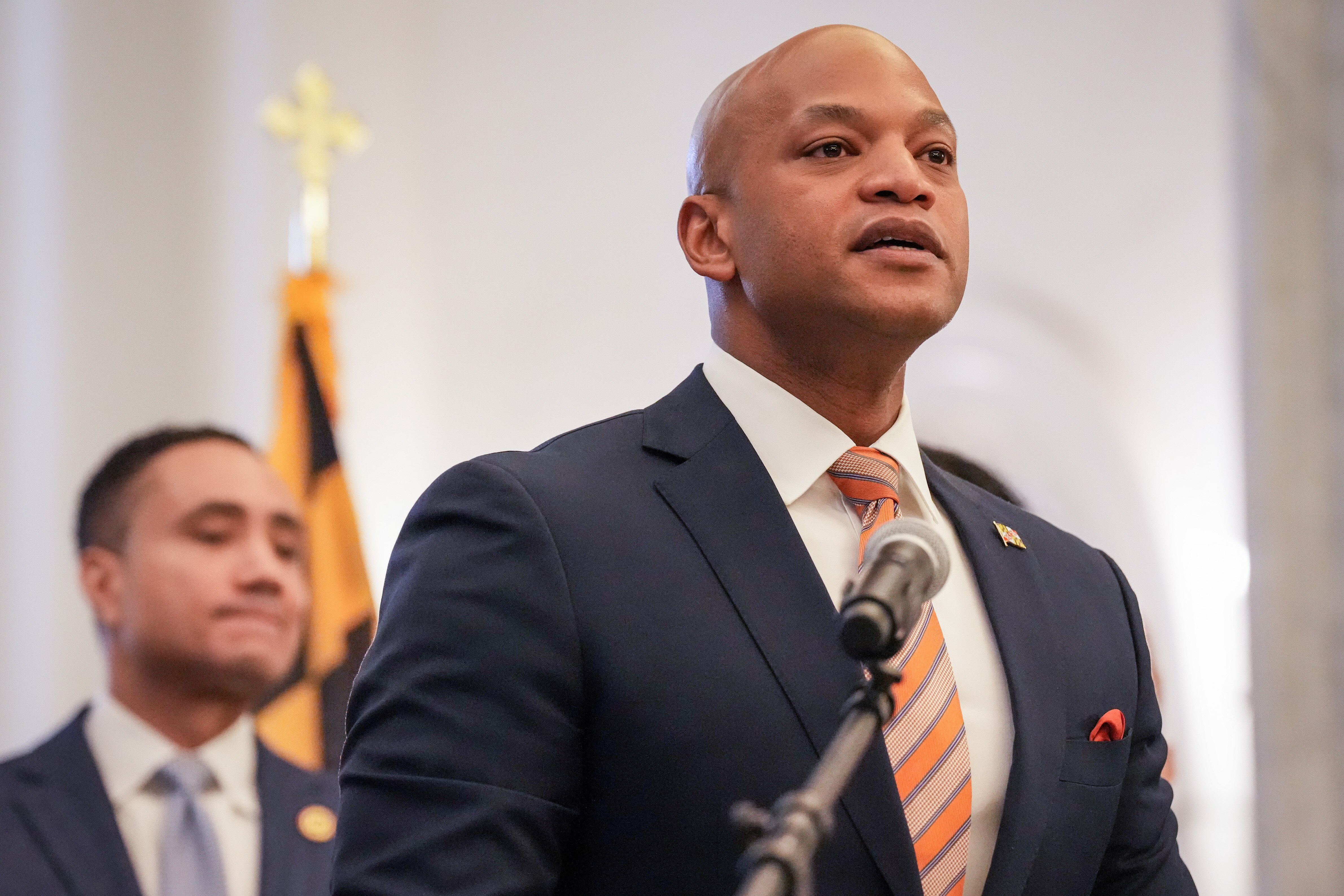 Gov. Wes Moore, flanked by Maryland House and Senate leadership, announces new juvenile justice legislation in the Maryland State House lobby on Jan. 31, 2024.