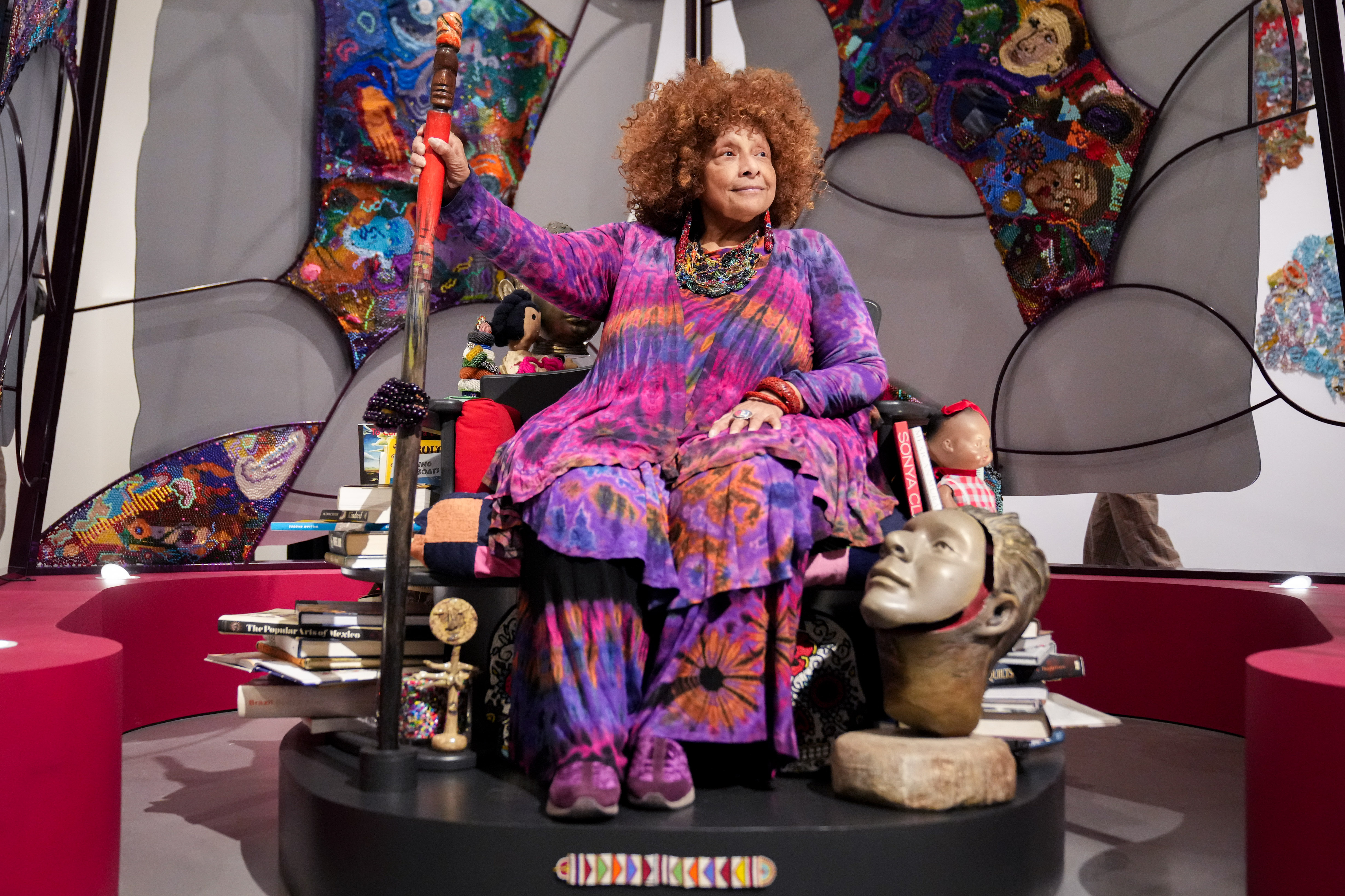 Baltimore artist Joyce J. Scott sits atop a throne inside a yurt installation in her retrospective exhibition, “Walk a Mile in My Dreams,” at the Baltimore Museum of Art.