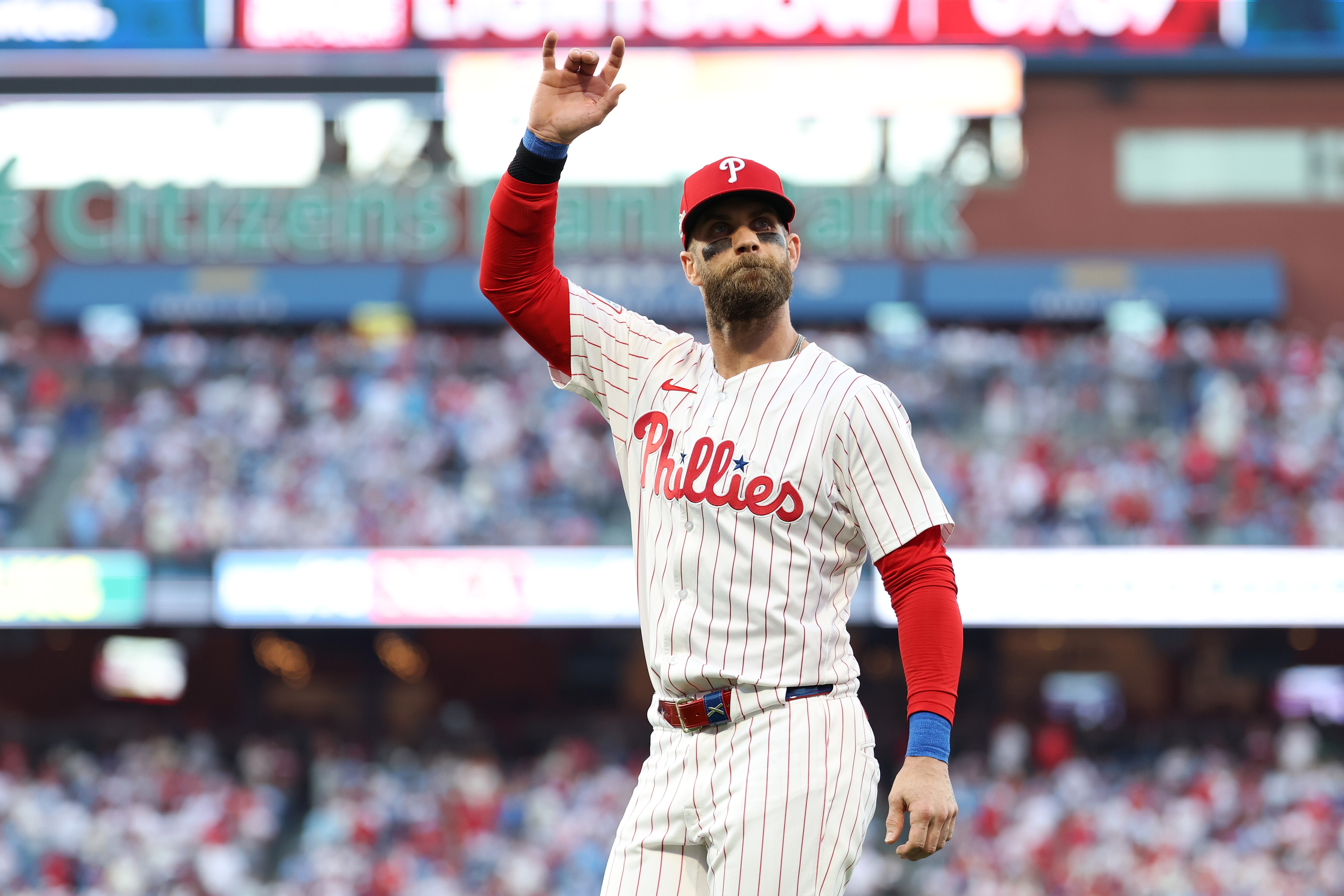 PHILADELPHIA, PENNSYLVANIA - OCTOBER 06: Bryce Harper #3 of the Philadelphia Phillies acknowledges the crowd before game two of the National League Division Series against the Los Angeles Dodgers at Citizens Bank Park on October 06, 2025 in Philadelphia, Pennsylvania. (Photo by Emilee Chinn/Getty Images)