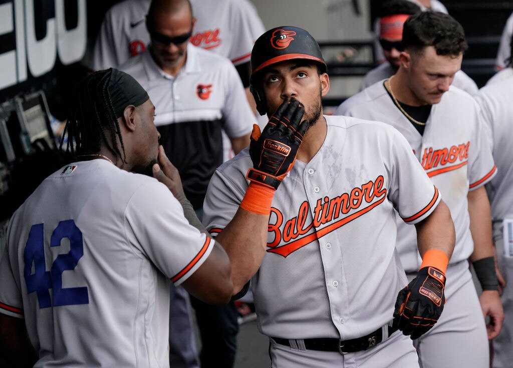 CHICAGO, ILLINOIS - APRIL 15: Anthony Santander #25 of the Baltimore Orioles celebrates in the dugout following a home run during the sixth inning against the Chicago White Sox at Guaranteed Rate Field on April 15, 2023 in Chicago, Illinois. All players are wearing the number 42 in honor of Jackie Robinson Day.