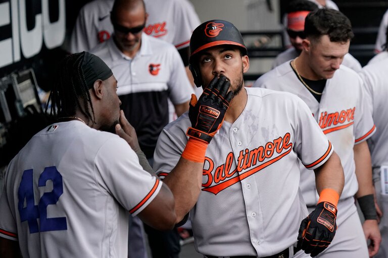 CHICAGO, ILLINOIS - APRIL 15: Anthony Santander #25 of the Baltimore Orioles celebrates in the dugout following a home run during the sixth inning against the Chicago White Sox at Guaranteed Rate Field on April 15, 2023 in Chicago, Illinois. All players are wearing the number 42 in honor of Jackie Robinson Day.