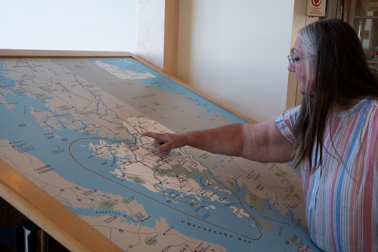 CAMBRIDGE, Md. - Chief Donna Wolf Mother Abbott points to places her ancestors had lived in what is now Dorchester County, Maryland, on a map in the Dorchester County Visitor Center.