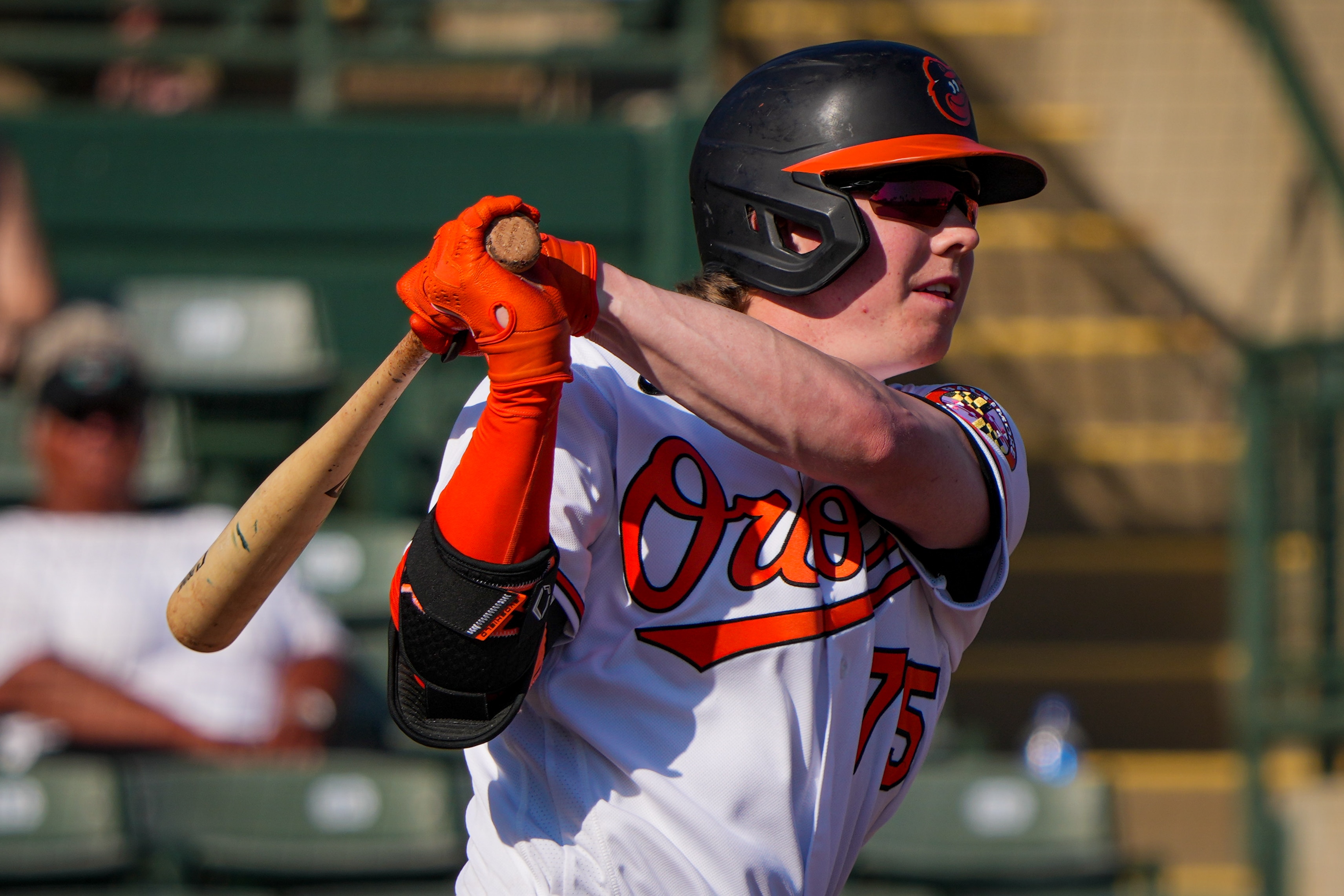 Heston Kjerstad (75) singles at Ed Smith Stadium during the eighth inning of a game against the Minnesota Twins on 2/25/23. The Baltimore Orioles hosted the Twins for their home opener as the Florida Grapefruit League started on Saturday.