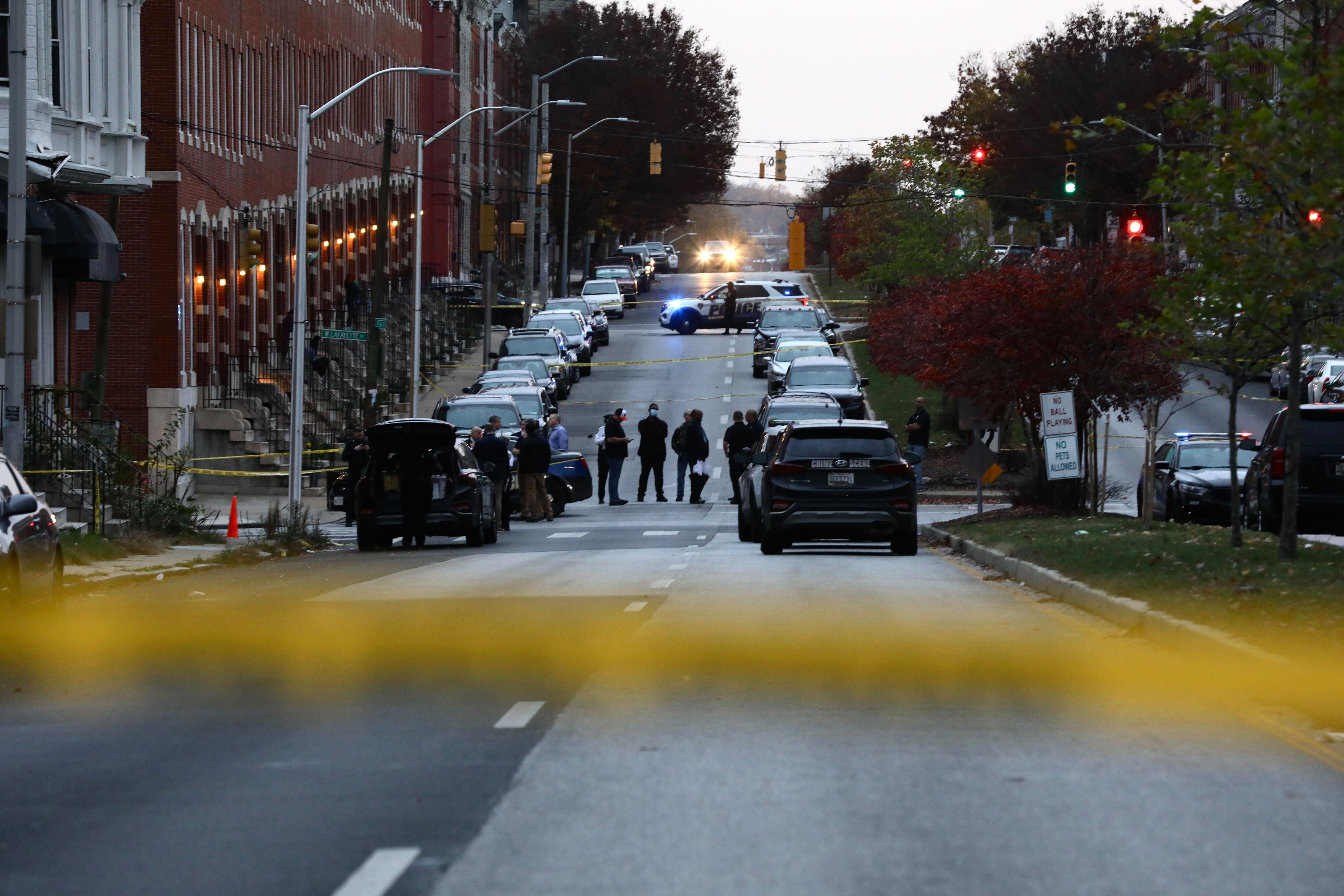 Baltimore police investigate a shooting by an officer at West Lanvale and North Fulton on Sunday afternoon, Nov. 6, 2022.