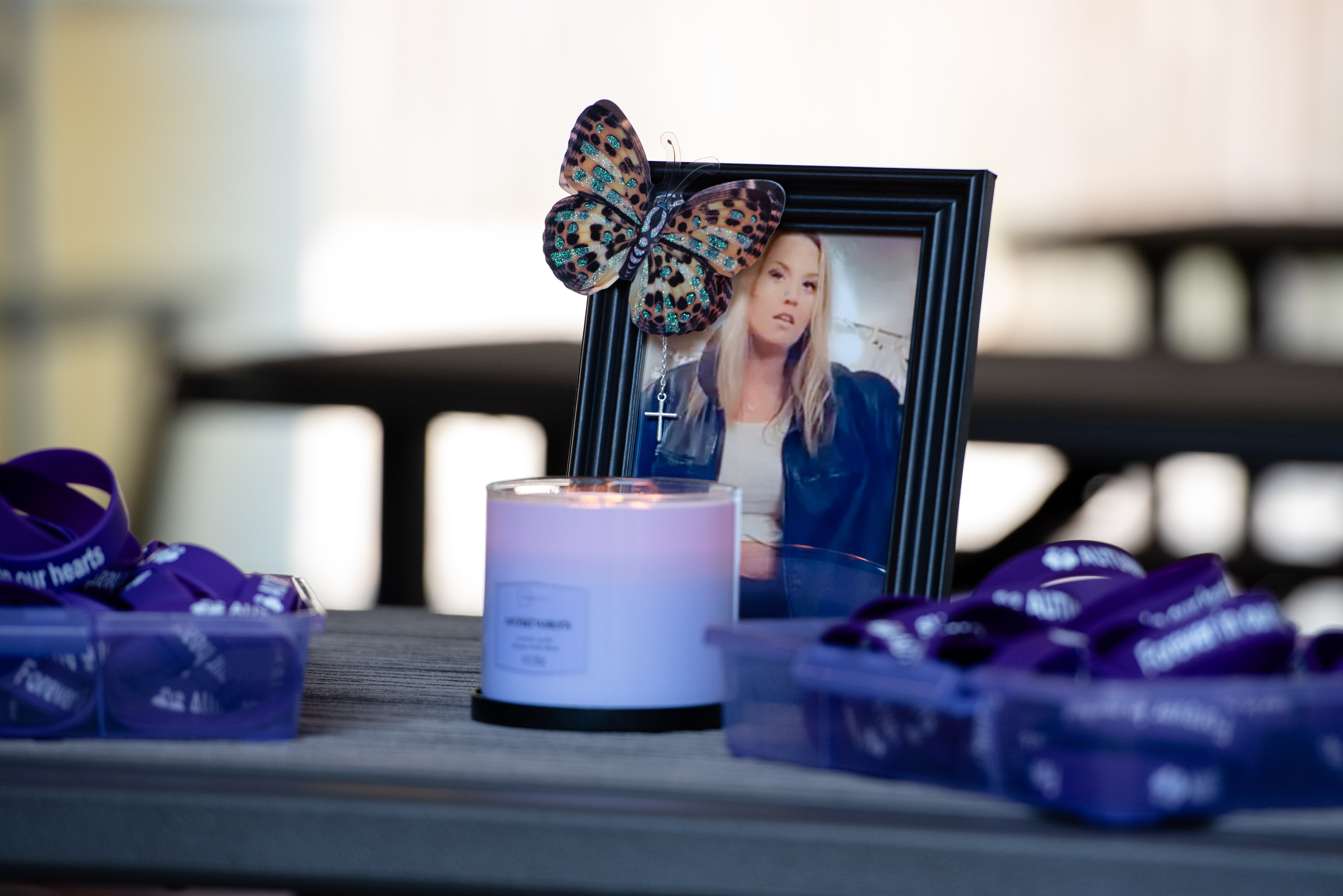 A butterfly-themed picture frame holds a photo of Autumn Harvey displayed during a vigil in her honor in Middle River on July 14, 2024. Baltimore County Police announced Thursday, Aug. 22, 2024, the arrest of 36-year-old Bryan Demetric Cherry in the death of Harvey and her grandmother, 75-year-old Iona Sellers. Cherry is charged with first-degree murder.