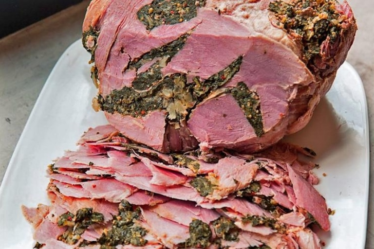 Stuffed ham, which is packed with greens and spices, is a St. Mary's County tradition.