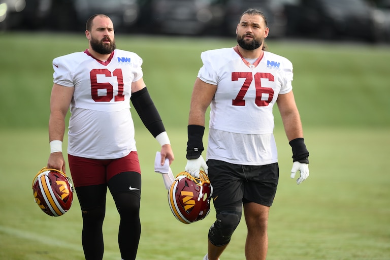 Washington Commanders offensive linemen Sam Cosmi (76) and Julian Good-Jones (61) during practice on Aug. 1.