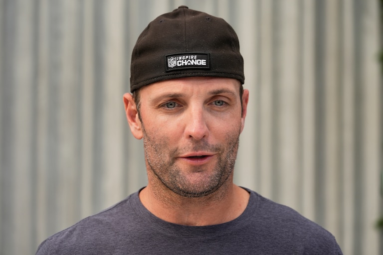 Wes Welker, picutred as the Miami Dolphins wide receivers coach, speaks after practice in June 2024.