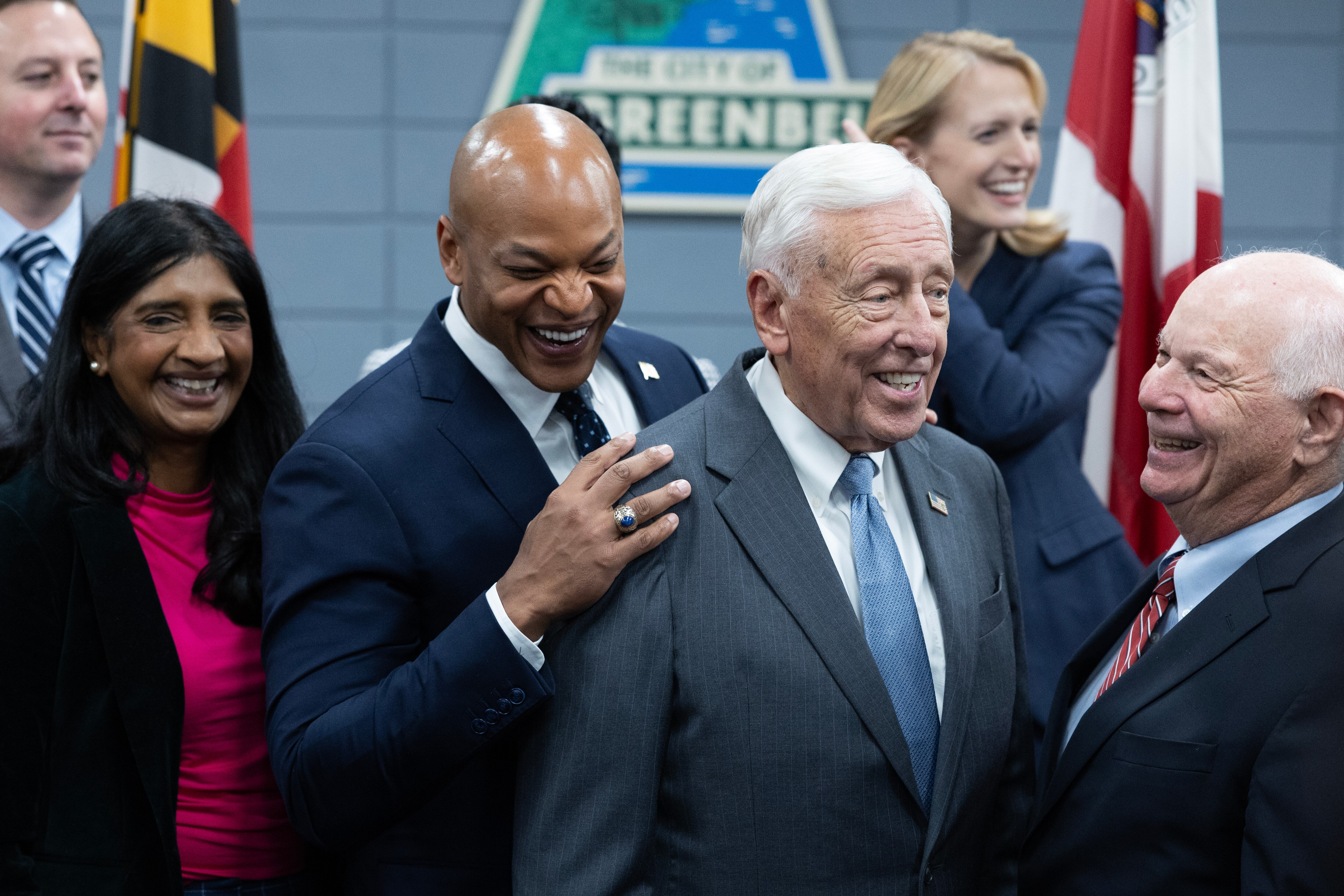 Maryland Gov. Wes Moore, second to left, reacts to a comment made by Rep. Steny Hoyer and Sen. Ben Cardin during a press conference on the selection of Greenbelt as the site of the new FBI headquarters on Friday, Nov. 10, 2023 in Greenbelt.