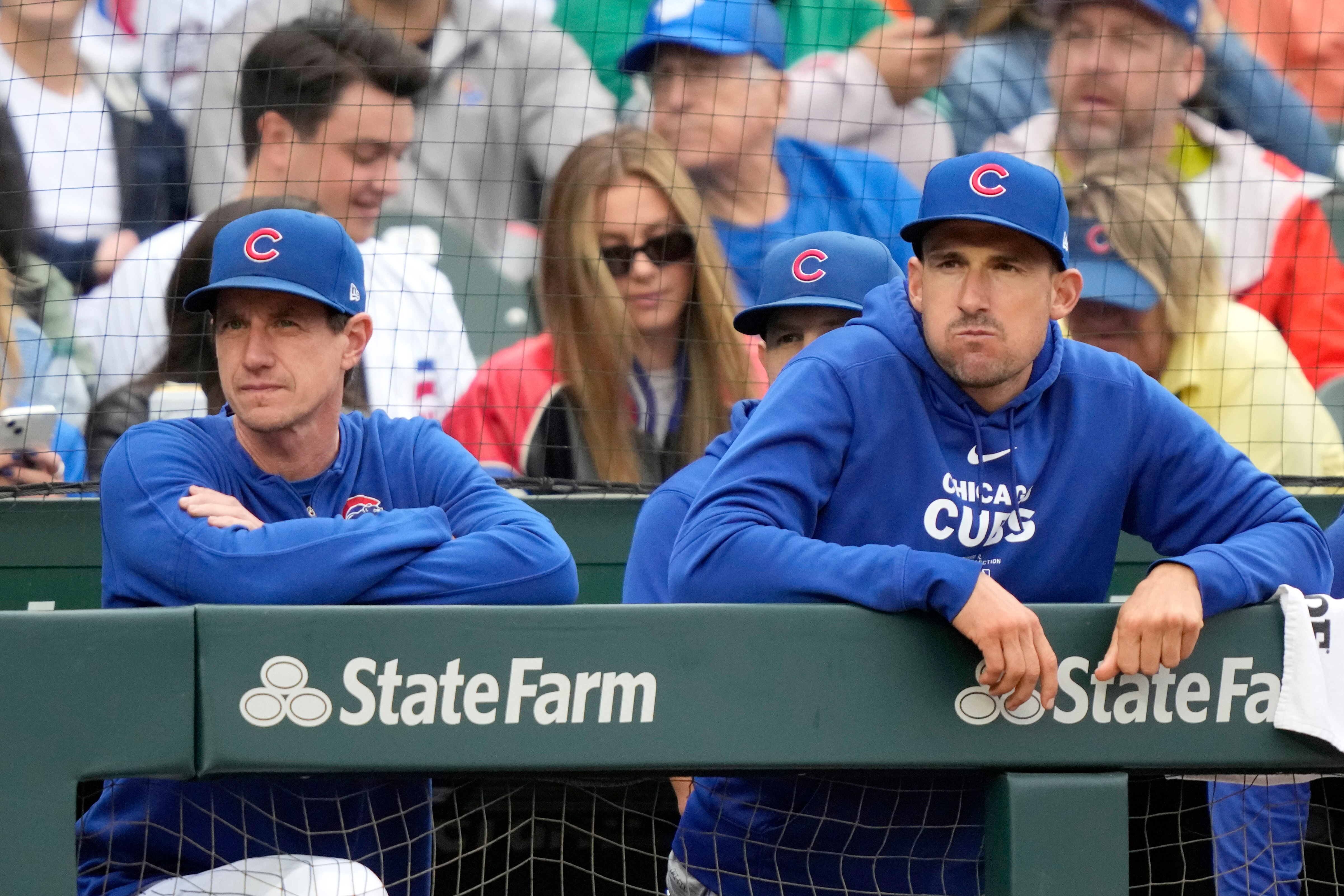 Chicago Cubs bench coach Ryan Flaherty, right, and manager Craig Counsell, left, look out over the field during the third inning of a baseball game against the Cincinnati Reds in 2024.