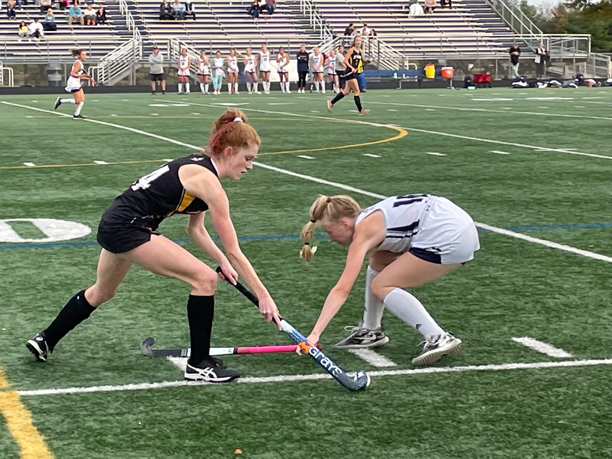Marriotts Ridge defender Kyleigh Klingler (right) tries to stop Mount Hebron’s Annabelle Kazanas from moving the ball down the sideline in Wednesday’s Class 3A East Region I field hockey championship. Host Marriotts Ridge won, 3-1, to advance to Friday’s state quarterfinals.