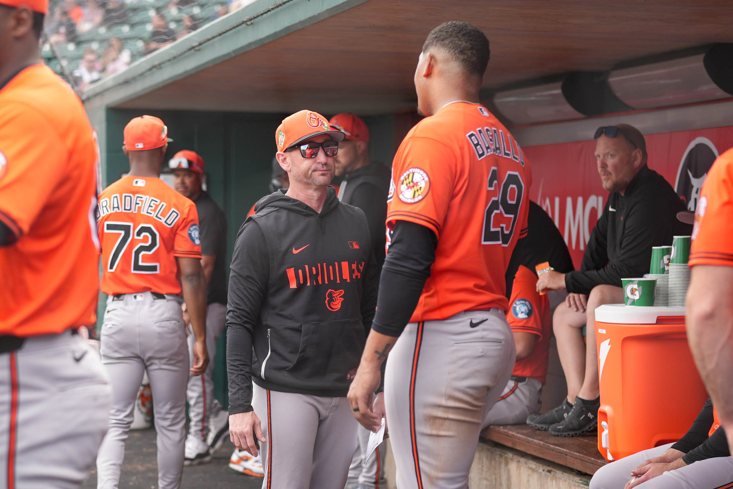 Orioles catcher Samuel Basallo (29) speaks with manager Craig Albernaz in the dugout after scoring in the second inning of a game against the Detroit Tigers on Feb. 22.