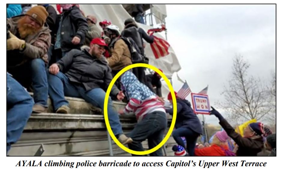 An image from federal court documents allegedly shows Carlos Ayala, circled in yellow in documents, at the U.S. Capitol on Jan. 6, 2021. Ayala is charged with civil disorder and other charges.