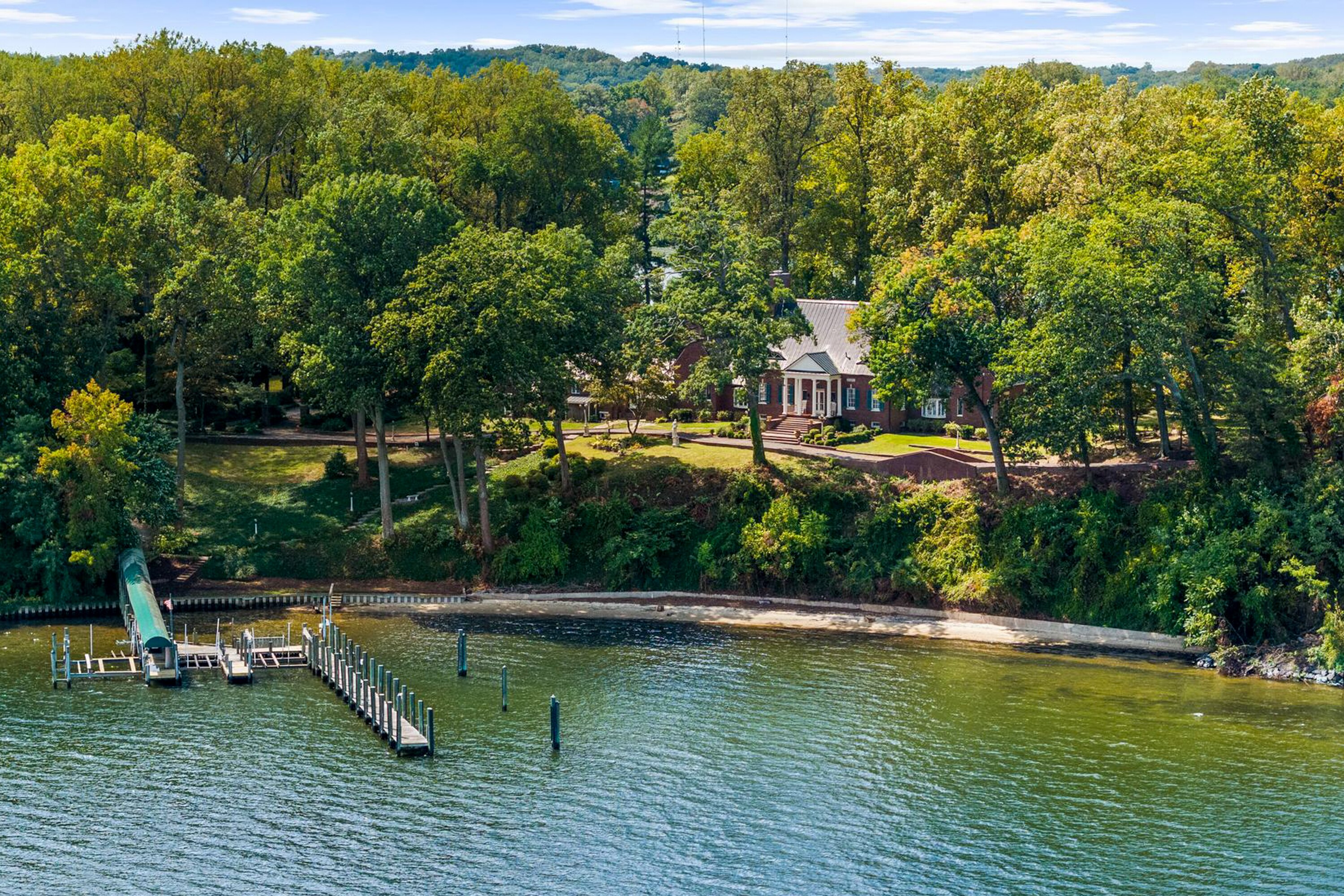 The nearly 7-acre property at St. Helena Island comes with a 7,100-square foot mansion, guest cottage, water tower-turned-office, and pier for access.